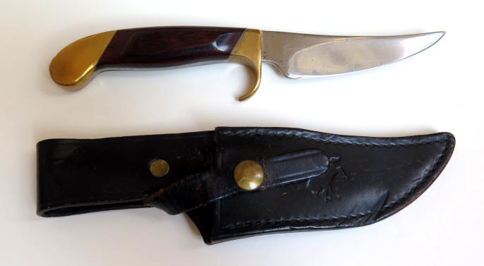Colt U1120 General Purpose knife with a 4.5 in. blade and rosewood handle and sheath