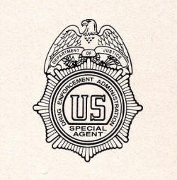 1984 DEA badge on M16 handbook
